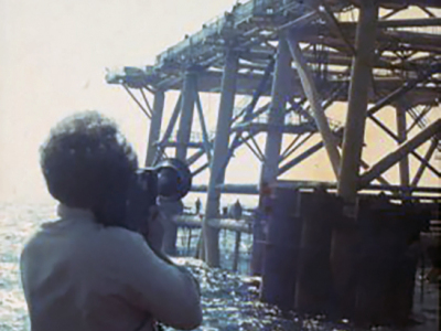 Me-filming-in-the-North-Sea-for-Occidental-Oil-as-the-worlds-biggest-sea-going-crane-lowers-the-deck-onto-Piper-Alpha.